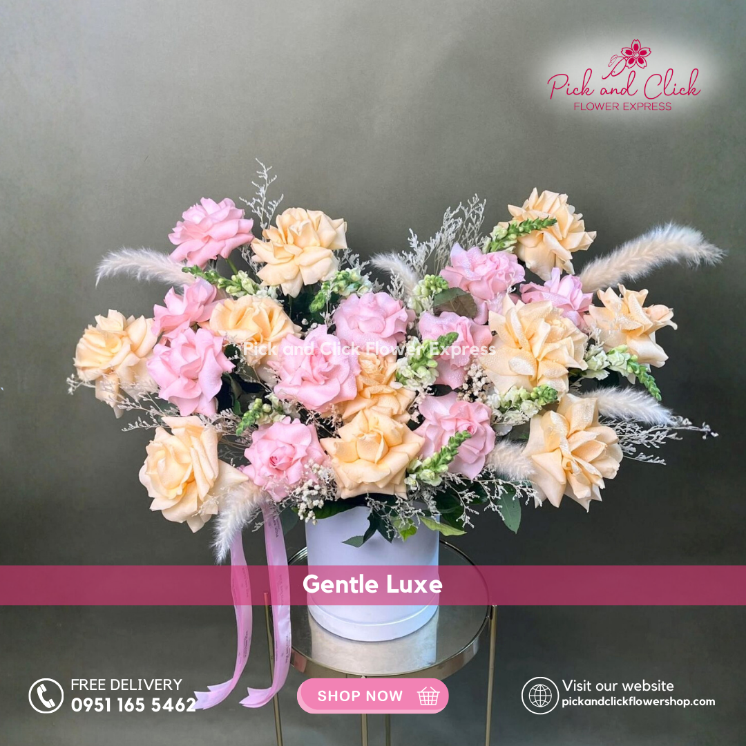 Gentle Luxe vase arrangement featuring imported light pink and peach roses, snapdragons, dried misty white, pampas, and rosal styled in an elegant glass vase.