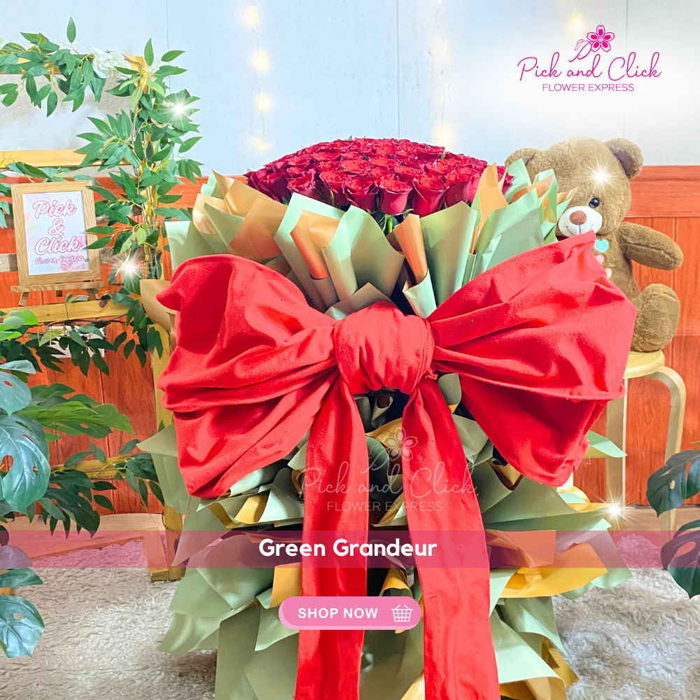 Bouquet of 100 long stem imported red roses in green and gold wrap with large red ribbon — luxurious romantic floral gift