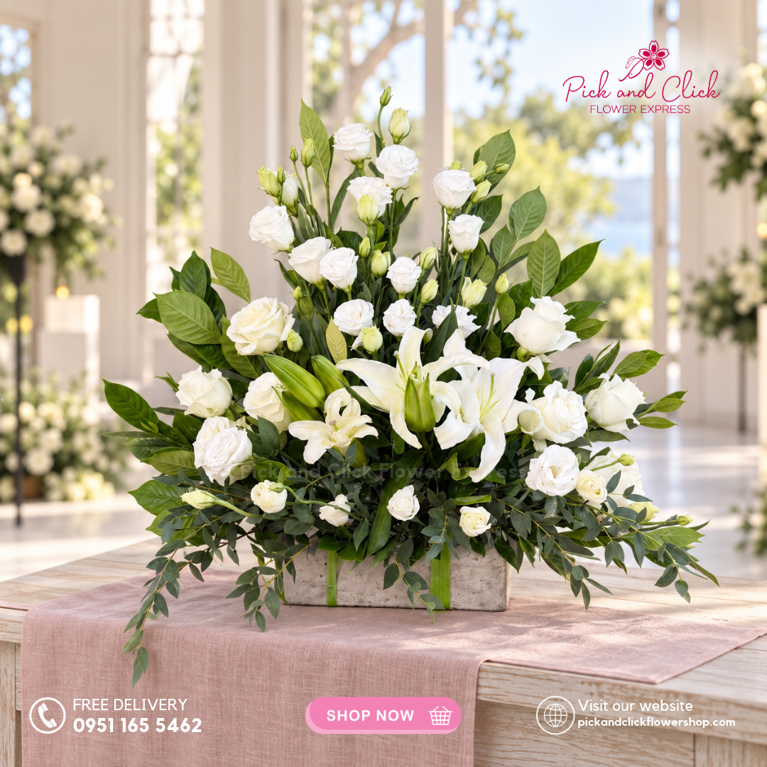 Mini Sympathy 12 mini funeral arrangement featuring imported white roses, white lilies or stargazers, white lisianthus or paper rose, parvi leaves, and rosal with same-day delivery in the Philippines.