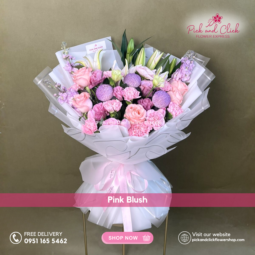 Bouquet with blue sprayed Wonder White, snapdragon, pink carnation, lisianthus, tulips, and stargazer in white wrap