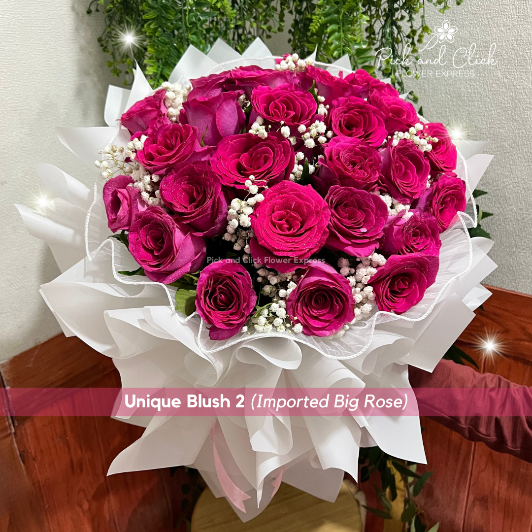 Bouquet of pink roses with gypsophila wrapped in white — soft, romantic floral gift