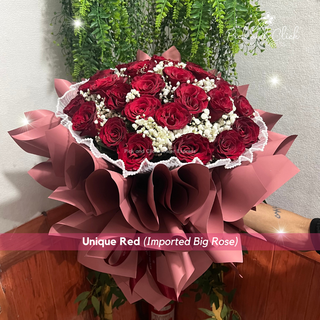 Bouquet of imported red roses with white gypsophila (baby’s breath), elegantly arranged