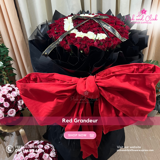 Bouquet of 200 long stem imported red roses in black wrap with custom initial and large red ribbon — personalized luxury floral gift