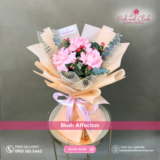 Blush Affection Bouquet featuring three light pink roses accented with berries and fresh eucalyptus in a delicate mini hand bouquet.