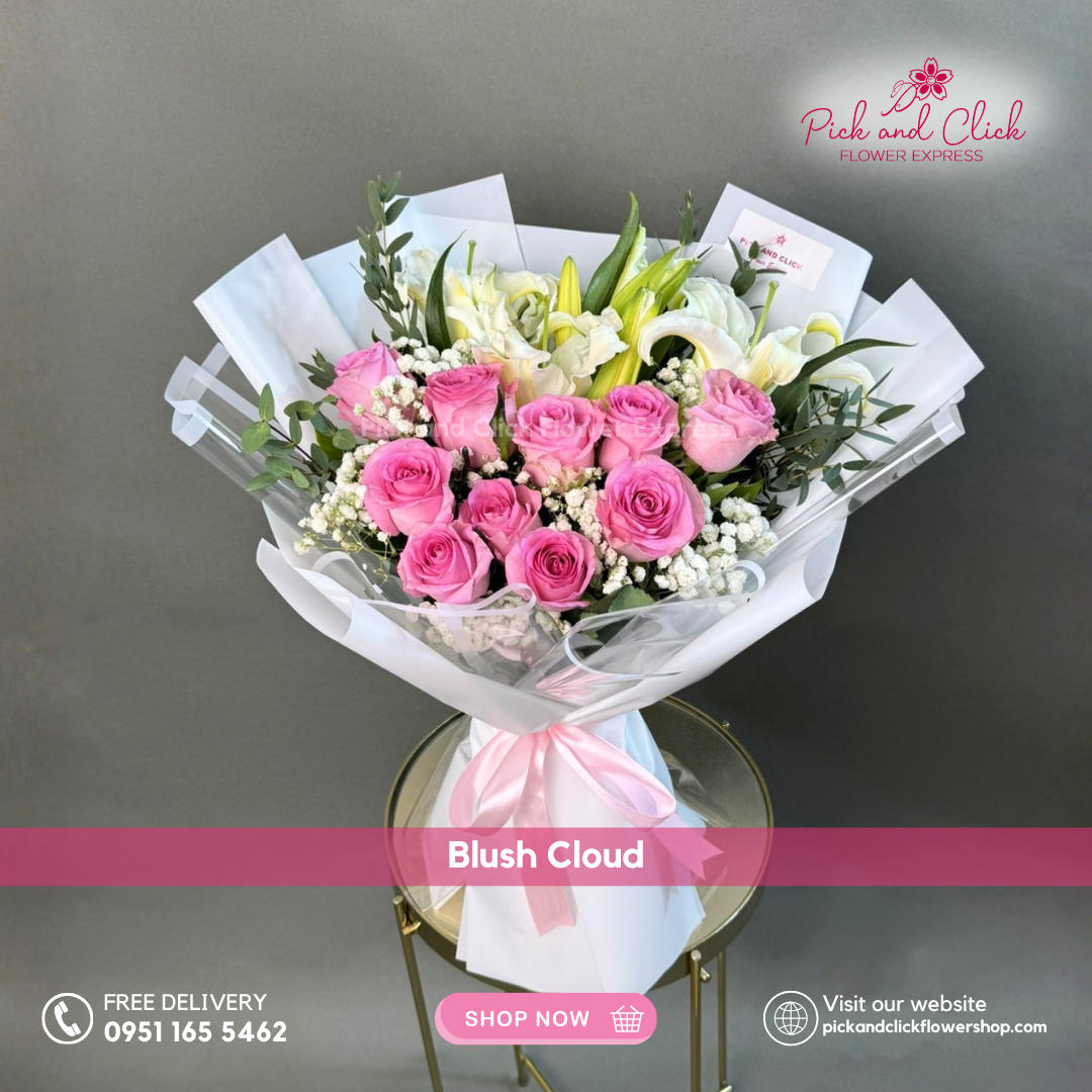 Blush Cloud bouquet featuring imported light pink roses, white lilies, gypsophila, and parvi leaves in a soft elegant floral arrangement.