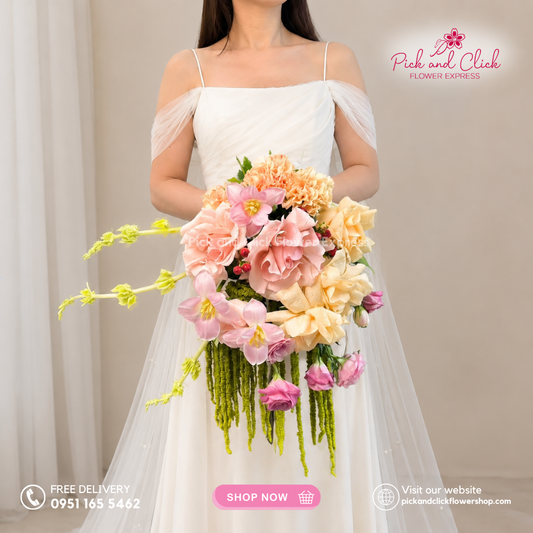 Bridal Bouquet 18 featuring Imported Light Pink Roses, Peach Roses, Pink Tulips, Champagne Carnations, Pink Lisianthus, Berries, Bells of Ireland, and Amaranthus in a romantic wedding bouquet.