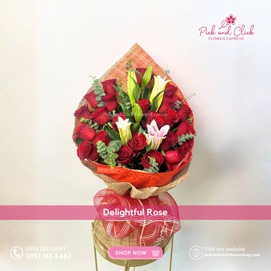Delightful Rose bouquet featuring 24 imported red roses, pink stargazers, and fresh eucalyptus arranged in an elegant hand bouquet for romantic and premium gifting.