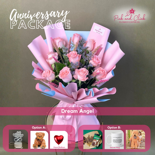 Dream Angel bouquet featuring imported light pink roses, misty blue, and pink sprayed trigo arranged in an anniversary gift package with optional add ons.