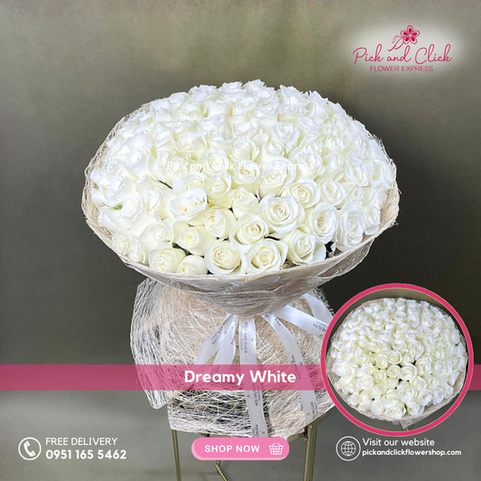 Dreamy White bouquet featuring 100 imported white roses arranged in a grand, elegant hand bouquet for luxury gifting and special occasions.