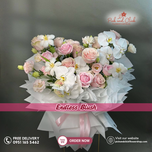 Endless Blush bouquet featuring Pink Ecuadorian roses, Light Pink Avalanche roses, White Tulips, Pink Tulips, and Phalaenopsis Orchids in a luxurious floral arrangement.