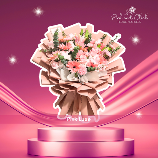 Pink China rose, gerbera, carnation, stargazer, and eucalyptus bouquet in rose gold wrap