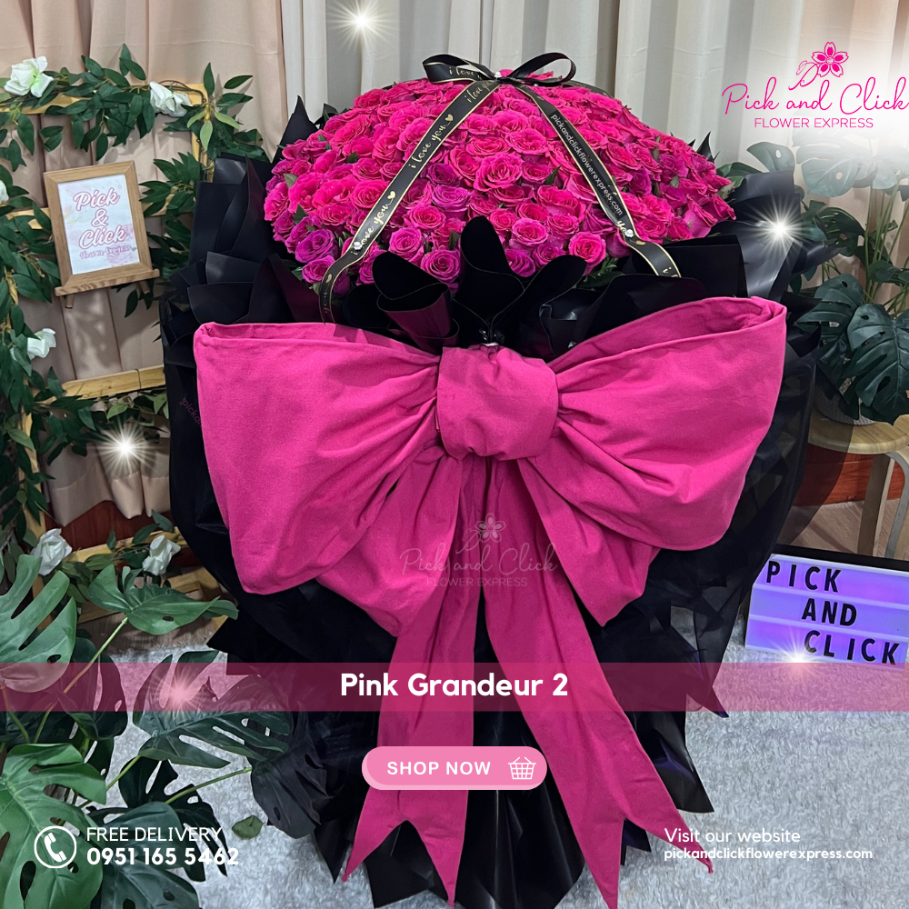 Bouquet of 200 long stem pink roses in black wrap with large ribbon — luxury romantic floral arrangement