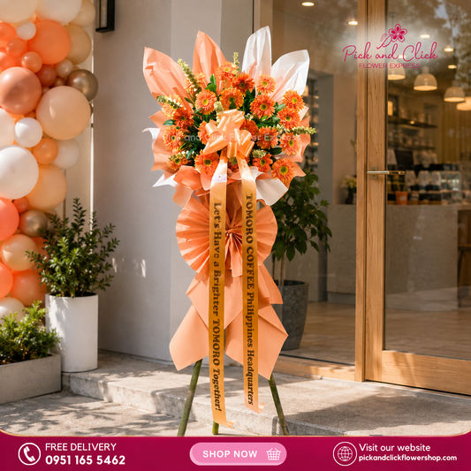 Imperial Luck Opening Stand featuring orange gerberas accented with rosal and fresh eucalyptus, a bright and cheerful floral arrangement designed to bring luck and celebrate grand openings, business launches, and special events in the Philippines.
