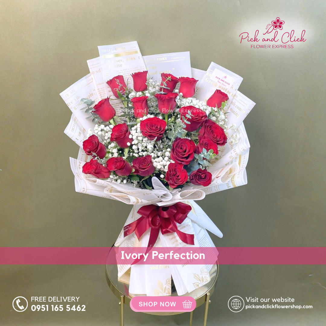 Bouquet of imported red roses, white gypsophila, and eucalyptus in artistic printed wrapping paper