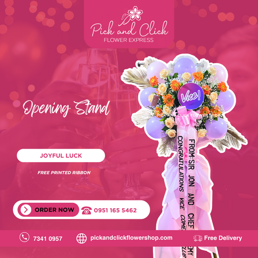 Joyful Luck Flower Stand featuring imported roses, gerbera, dried palm leaves, gypsophila, balloons, and a customized printed ribbon, a vibrant and festive floral arrangement perfect for grand openings, celebrations, and special events in the Philippines.