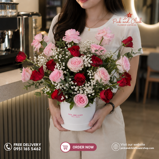 Love Treasure Round Box Arrangement featuring 10 Imported Red Roses, 10 Imported Light Pink Roses, Gypsophila, and Parvi Leaves in a romantic floral arrangement in the Philippines.