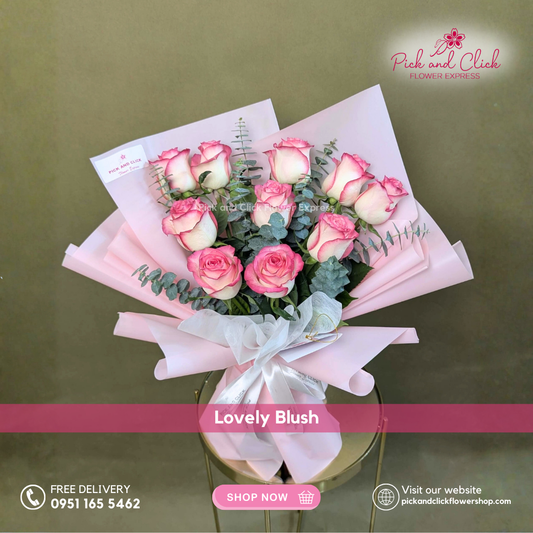 Lovely Blush Bouquet featuring 10 pieces of two tone pink roses accented with fresh eucalyptus arranged in an elegant hand bouquet for romantic and all occasion gifting.