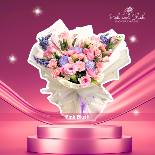 Bouquet with blue sprayed Wonder White, snapdragon, pink carnation, lisianthus, tulips, and stargazer in white wrap