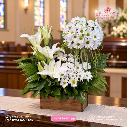 Mini Sympathy 1 featuring a mini funeral arrangement with white chrysanthemum, white stargazer, fresh leaves, and green fillers, a simple yet elegant sympathy floral design for respectful tributes and memorial services in the Philippines.