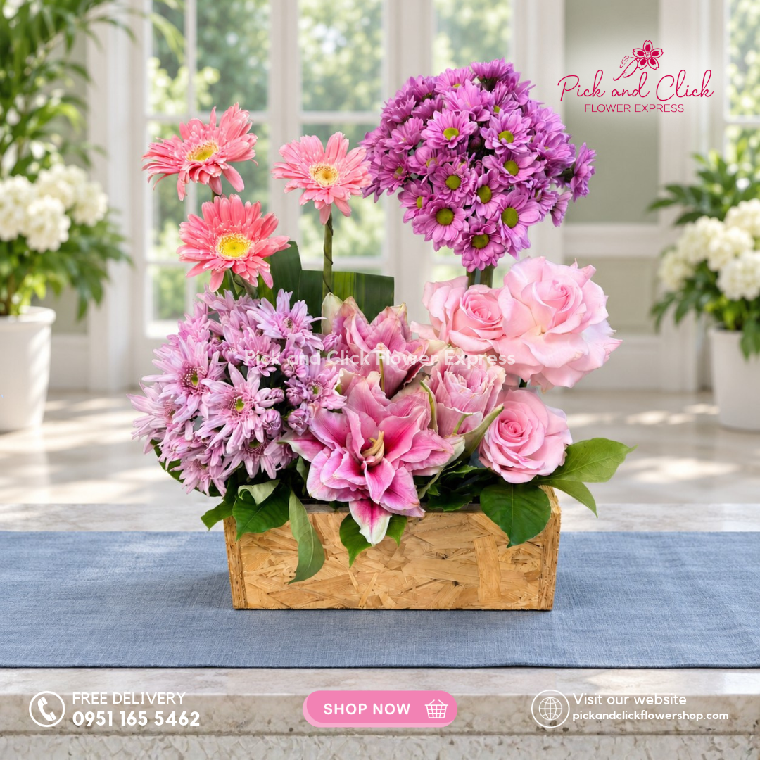 Mini Sympathy 21 mini sympathy arrangement in a box with 3 light pink roses, 3 pink gerberas, double-petal pink lily, mums, fortune leaves, and rosal, available with same-day delivery in the Philippines.