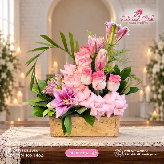 Mini Sympathy 25 mini funeral arrangement with 5 light pink roses, 6 two-tone pink roses, 2 stems of double-petal pink lilies/stargazers, lycopodium, palmera, and rosal, available with same-day delivery in the Philippines.