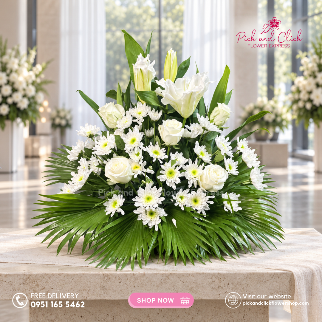 Mini Sympathy 26 mini funeral arrangement with 5 imported white roses, 1 stem of double-petal white lily/stargazer, radus, anahaw, and greenline leaves, available with same-day delivery in the Philippines.