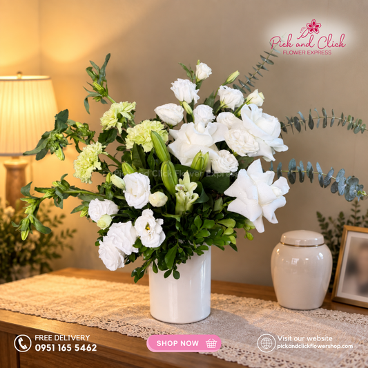 Mini Sympathy 5 featuring a mini funeral arrangement with white roses, white lisianthus, white stargazer, green carnation, campanula, a simple yet elegant sympathy floral design for respectful tributes and memorial services in the Philippines.