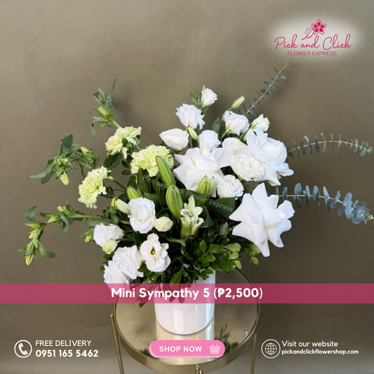 Mini Sympathy 5 featuring a mini funeral arrangement with white roses, white lisianthus, white stargazer, green carnation, campanula, a simple yet elegant sympathy floral design for respectful tributes and memorial services in the Philippines.
