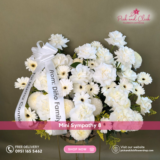 Mini Sympathy 8 featuring a mini funeral arrangement with white roses, white gerberas, white sunlight flowers, and golden rod, a simple yet elegant sympathy floral design for respectful tributes and memorial services in the Philippines.