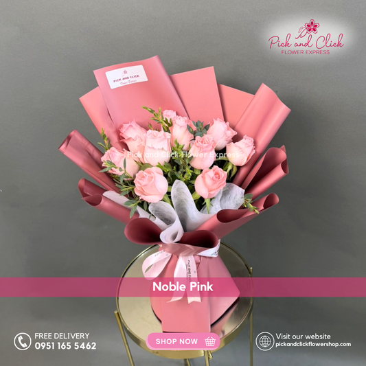 Noble Pink bouquet featuring 10 imported light pink roses with parvi leaves arranged in a soft elegant hand bouquet.