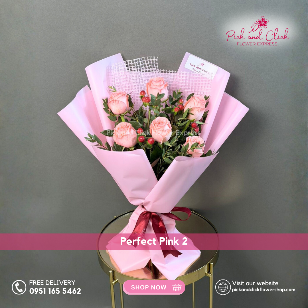 Perfect Pink 2 Bouquet featuring six imported light pink roses accented with berries and parvi leaves in an elegant hand bouquet.
