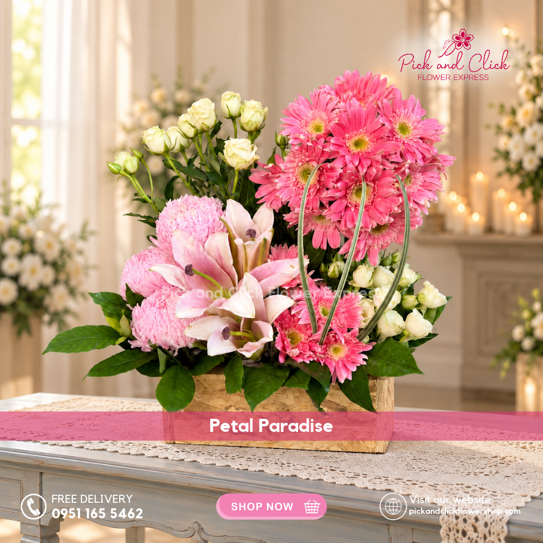 Petal Paradise box flower arrangement featuring pink gerberas, pink lilies or stargazers, pink sunlight chrysanthemums, white spray roses, and rosal by Pick and Click Flower Express.