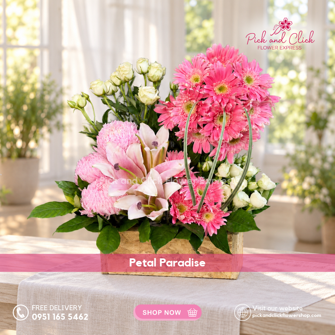 Petal Paradise box flower arrangement featuring pink gerberas, pink lilies or stargazers, pink sunlight chrysanthemums, white spray roses, and rosal by Pick and Click Flower Express.