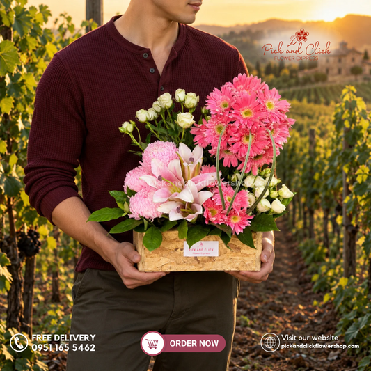 Petal Paradise box flower arrangement featuring pink gerberas, pink lilies or stargazers, pink sunlight chrysanthemums, white spray roses, and rosal by Pick and Click Flower Express.