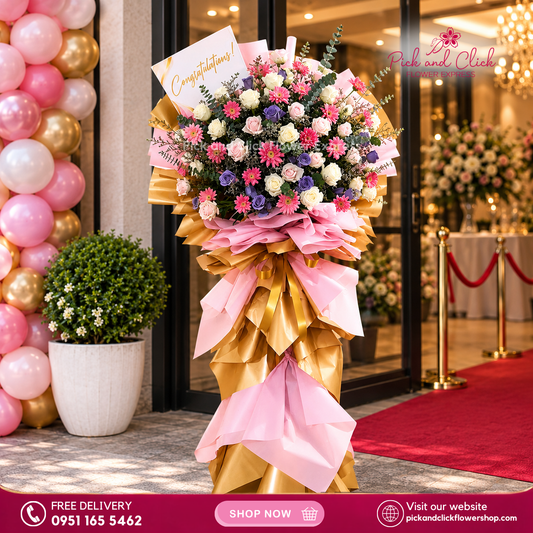 Pink Beginning Opening Stand featuring white and light pink imported roses, moody blue roses, pink gerberas, misty blue, fresh eucalyptus, and rosal, a vibrant and elegant floral arrangement designed for grand openings, celebrations, and special events in the Philippines.