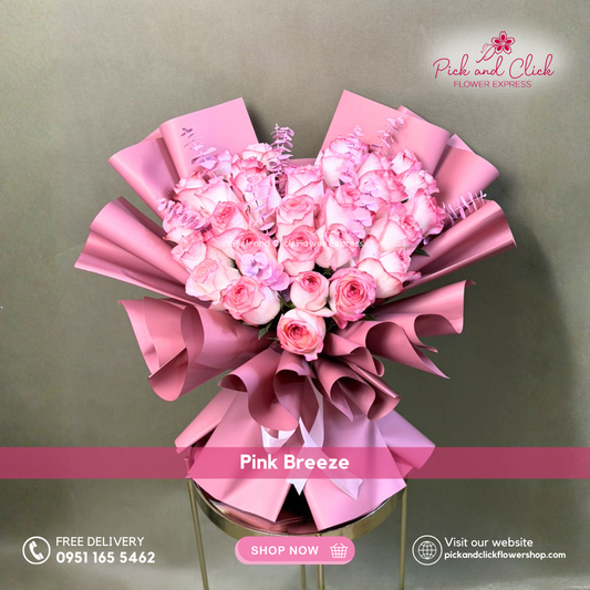 Pink Breeze Bouquet featuring 30 two tone pink roses accented with pink sprayed eucalyptus in an elegant premium hand bouquet.