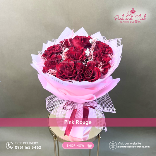 Pink Rogue Bouquet featuring imported red roses, dried misty pink, and gypsophila in an elegant premium hand bouquet.