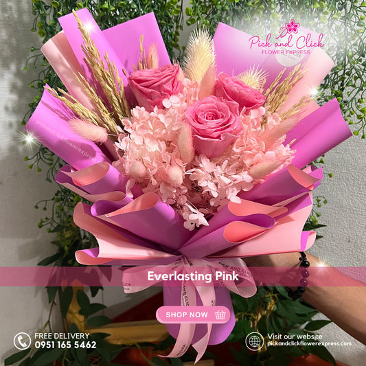 Pink Ecuadorian rose bouquet with dried flowers in pink and purple two-tone wrap