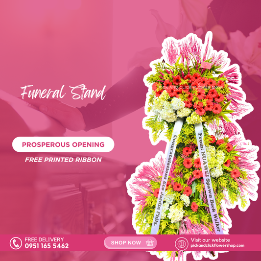 Prosperous Opening funeral stand featuring red gerberas, white hydrangeas, golden rod, yellow corn leaves, and trigo arranged in a dignified standing sympathy display.