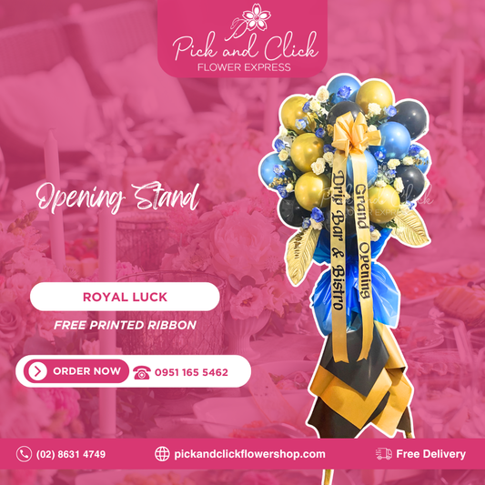 Royal Luck opening stand featuring imported white roses, blue sprayed white roses, gold sprayed dieffenbachia and eucalyptus with balloons, designed for grand openings and business celebrations.