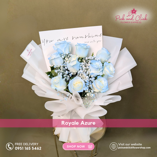 Bouquet of blue and white flowers with a card on a brown background, featuring 'Pick and Click Flower Express' branding.