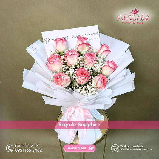 Royale Sapphire bouquet featuring ten two tone pink roses with gypsophila arranged in a soft and elegant hand bouquet.