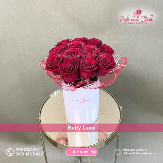 Ruby Luxe vase arrangement featuring twelve imported red roses arranged elegantly in a glass vase for a classic romantic display.
