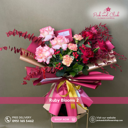 Ruby Blooms 2 Bouquet featuring imported red roses, two tone roses, carnations, decorative berries, Bells of Ireland, and dried parvi leaves, a rich and elegant floral arrangement perfect for romantic gifts, birthdays, anniversaries, and special occasions in the Philippines.