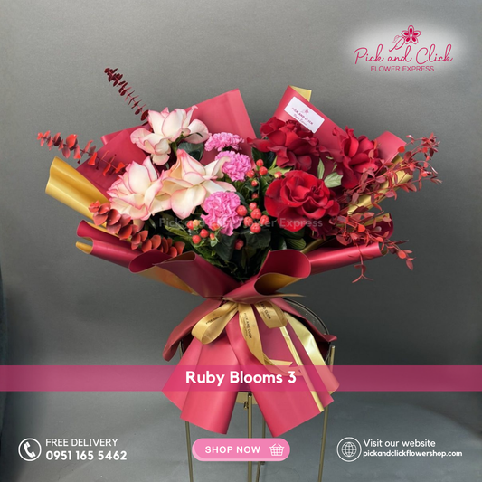 Ruby Blooms 3 bouquet featuring imported red roses, two tone pink roses, hot pink carnations, berries, and red sprayed foliage in a romantic floral arrangement.