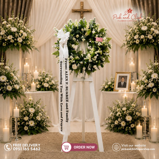 Surrounded Comfort Funeral Stand featuring white roses, orchids, Pako leaves, eucalyptus, and silver dollar leaves in an elegant white and green funeral flower arrangement for sympathy, memorial services, and funeral ceremonies in Metro Manila, Philippines.