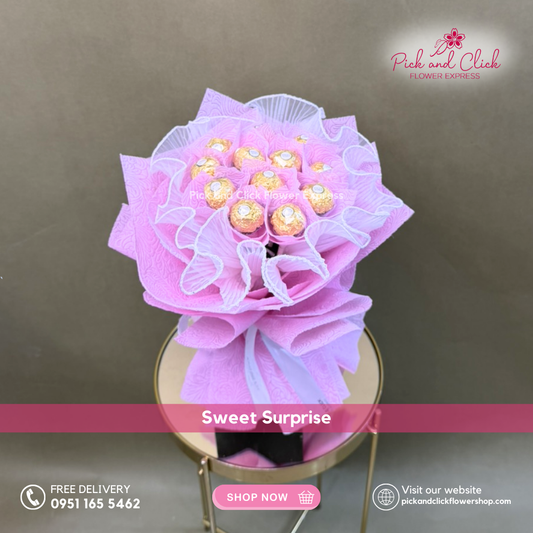 Fancy Gold Bouquet featuring peach roses, pink spray roses, and snapdragon arranged in an elegant hand bouquet for refined all occasion gifting.