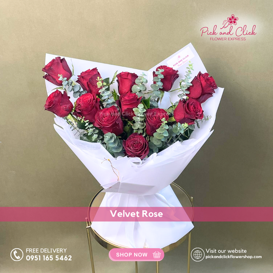 Velvet Rose Bouquet featuring 12 imported red roses and fresh eucalyptus in an elegant hand bouquet, perfect for romantic occasions and premium flower gifting.