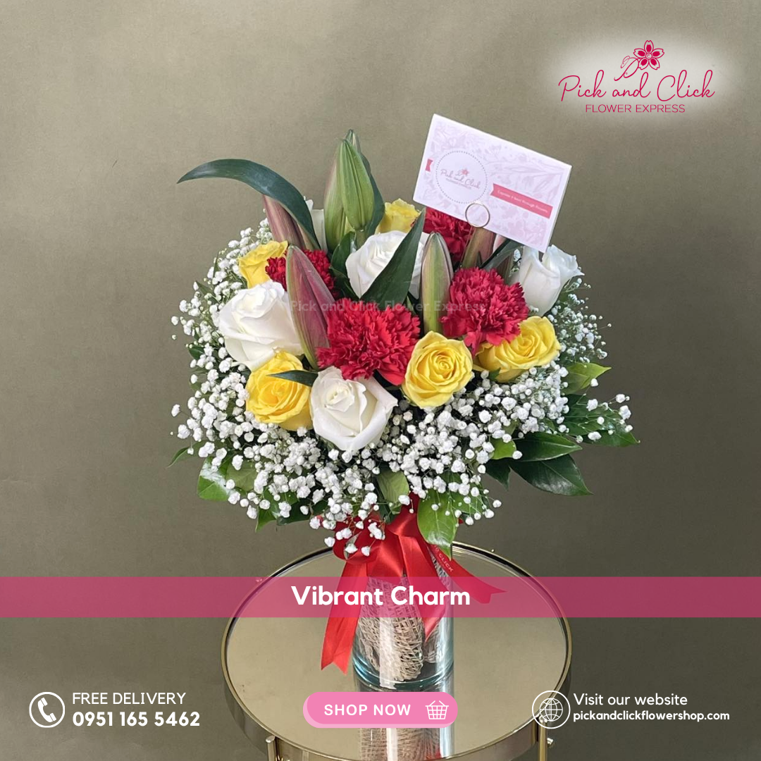 Vibrant Charm Vase Arrangement featuring imported white and yellow roses, red carnations, pink stargazer lilies, and delicate gypsophila, a bright and cheerful floral display perfect for celebrations, gifts, and special occasions in the Philippines.