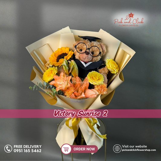 Victory Sunrise 2 Bouquet featuring a graduation stuff toy, sunflower, orange lily, yellow roses, two-tone orange and yellow carnations, and eucalyptus in a vibrant graduation floral arrangement.